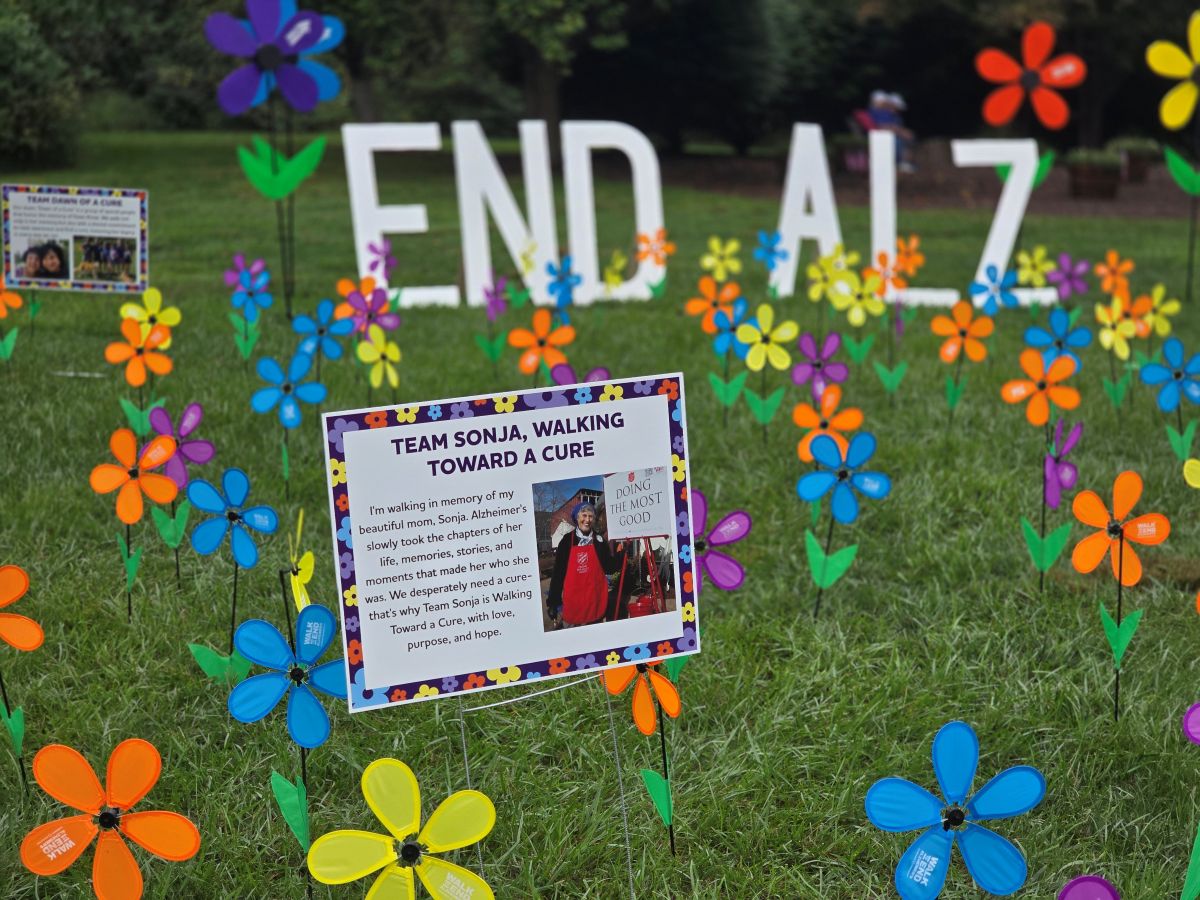 the Team Sonja poster amoung the Garden of Flowers at Walk to End Alzheimer’s